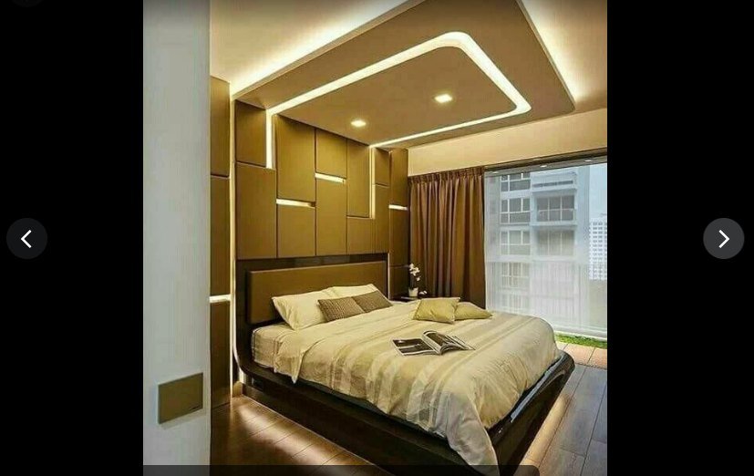 Bedroom with panelled headboard wall and cove lighting
