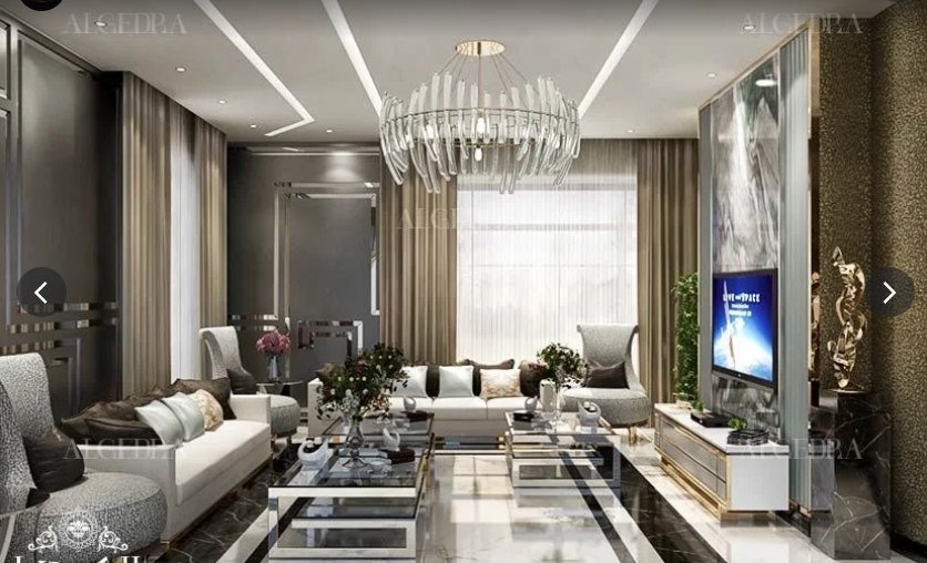 Living room with ivory sofas and brass chandelier